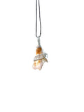 Shell pendant on a chain against a white background