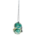 Necklace with a turquoise shell pendant on a white background