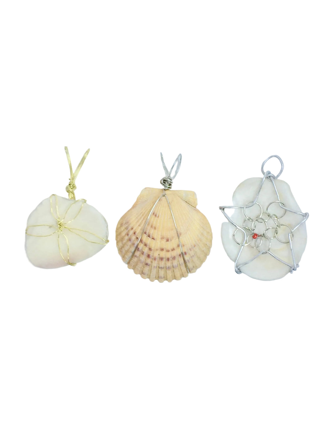 Three shell-shaped pendants on white background