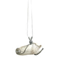 Silver necklace with a unique pendant on a white background