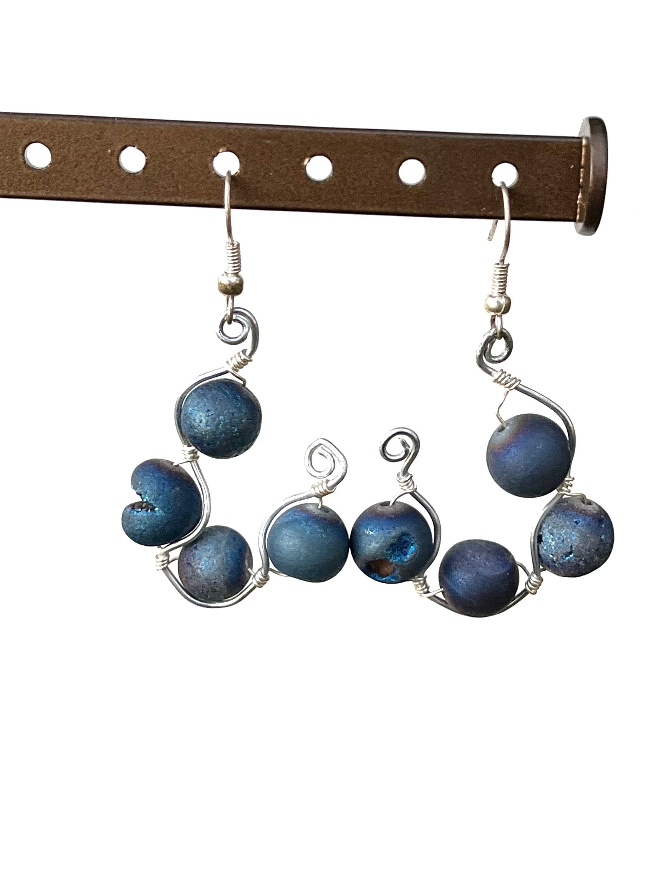 Blue beaded earrings on a white background
