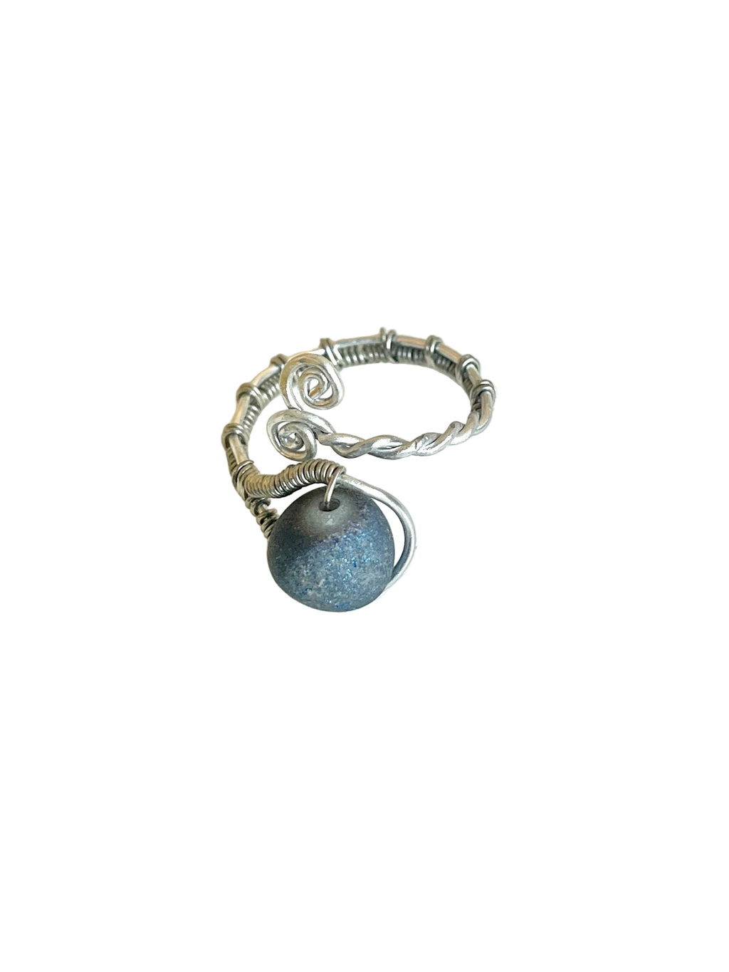 Silver ring with a blue stone on a white background