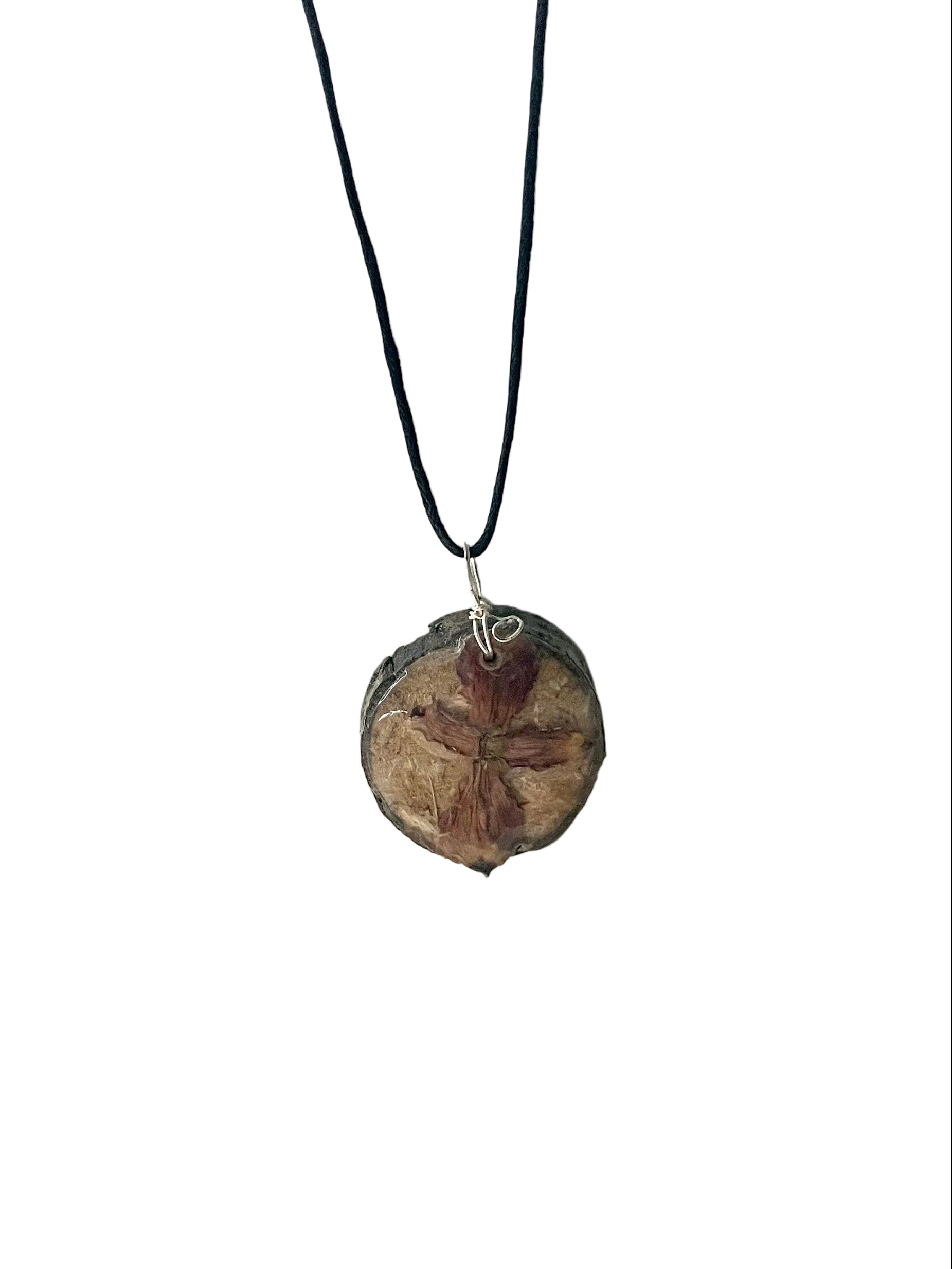Necklace with a round, brown pendant on a white background