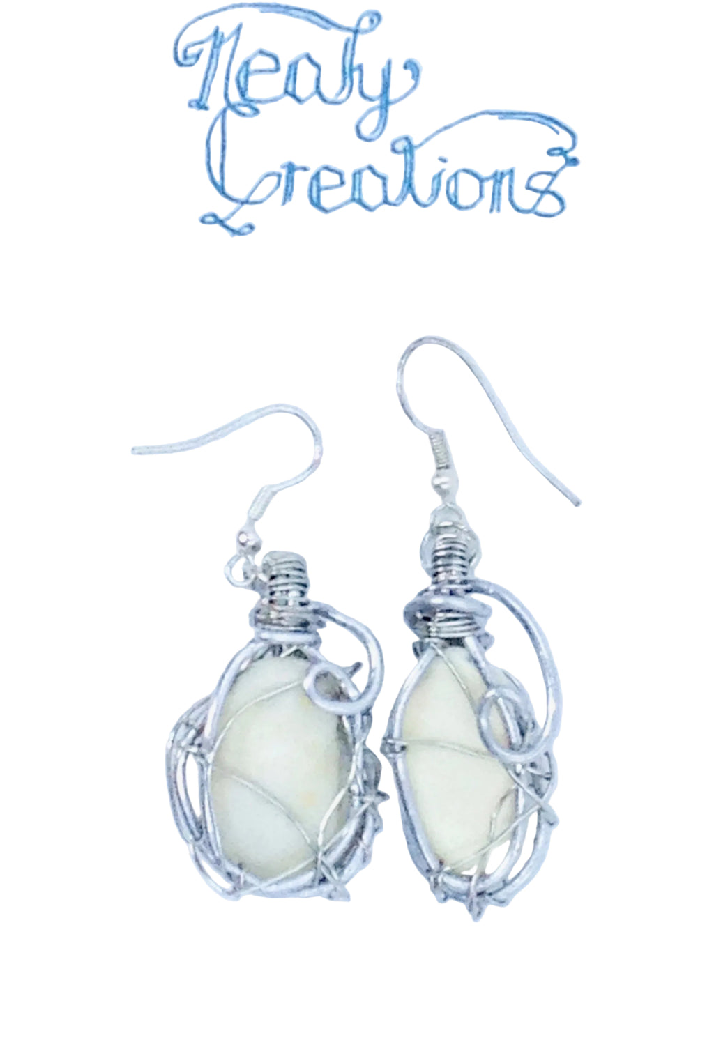 Silver wire-wrapped earrings with white shells on a white background