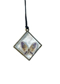 Necklace with a pendant featuring butterfly oyster on a white background