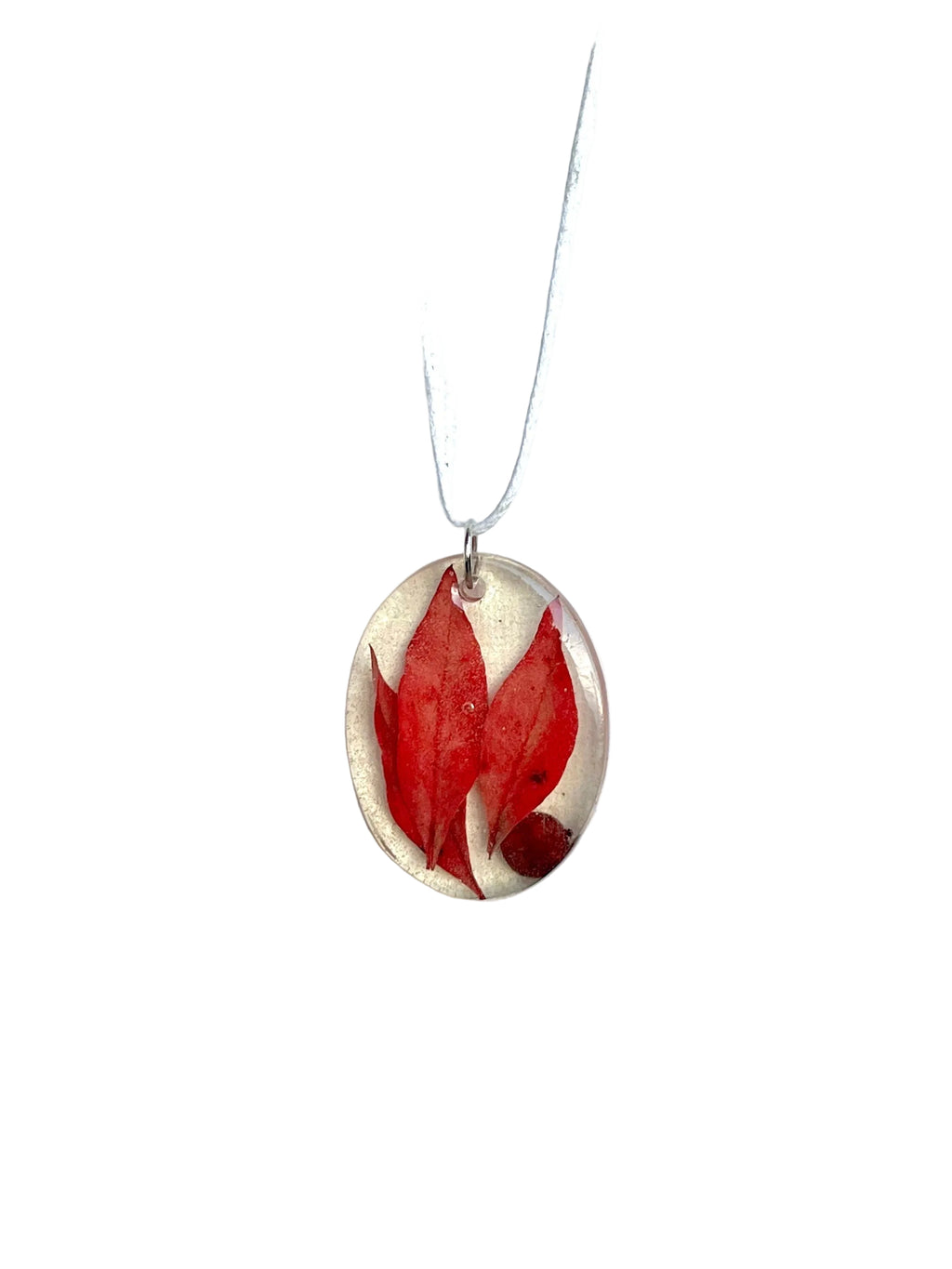 Necklace with a red leaf pendant on a white background