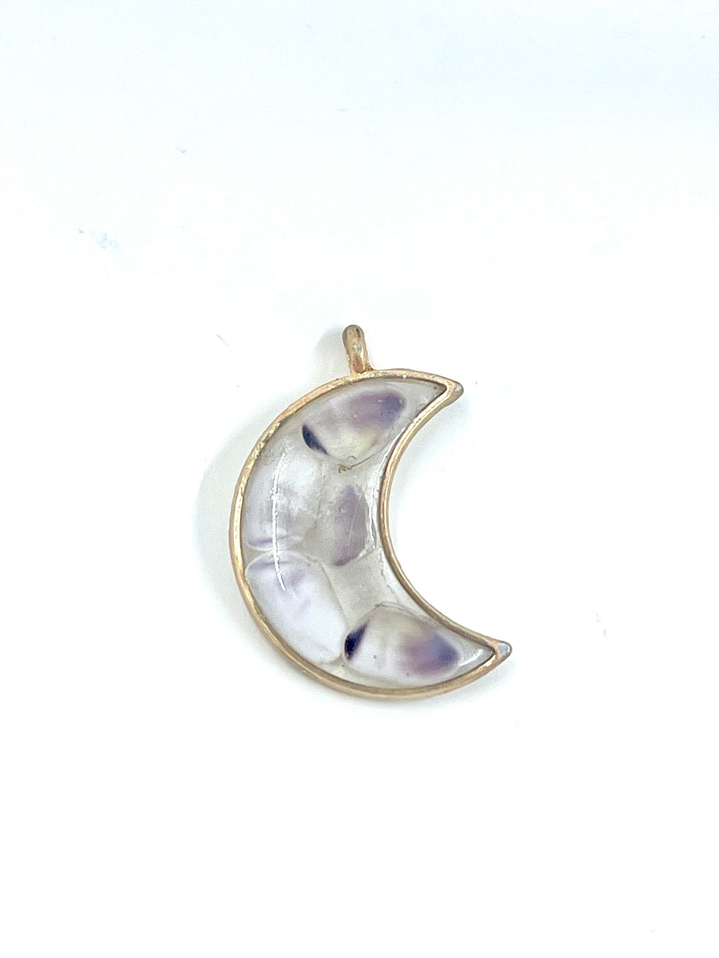 Crescent moon-shaped pendant with a gold outline on a white background