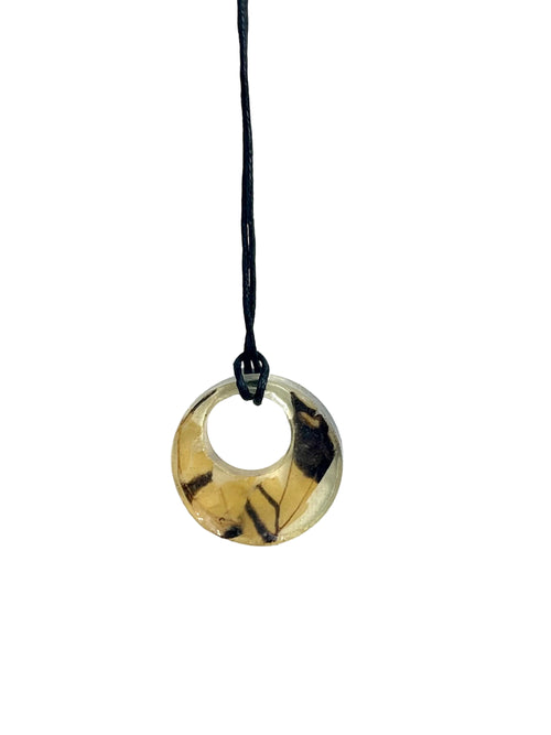 Necklace with a round pendant on a white background